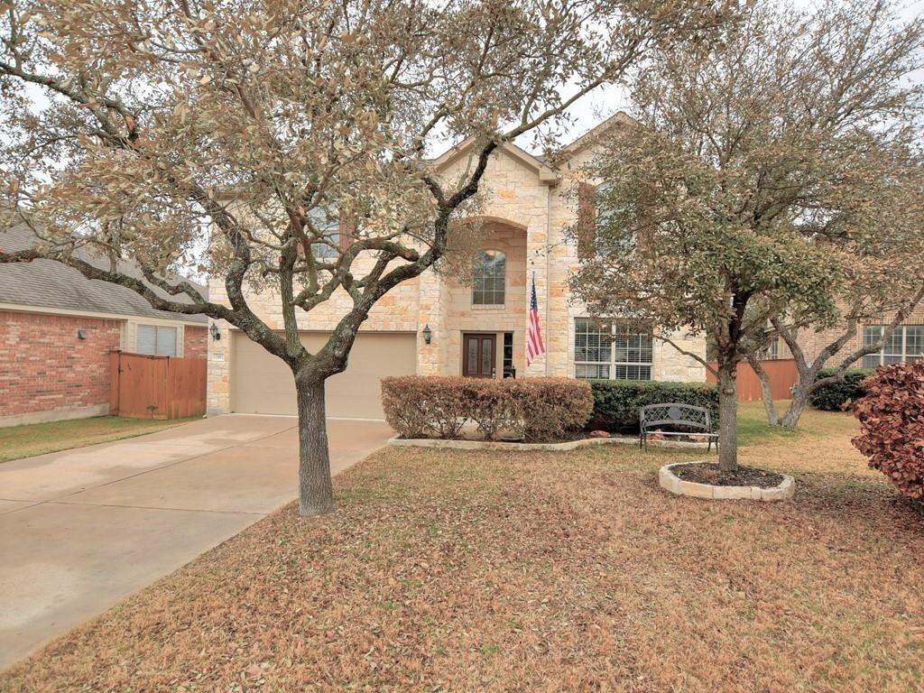 241 Caddo Lake Drive Georgetown, TX 78628 - Photo 2 of 25 a front view of a house with a yard and garage