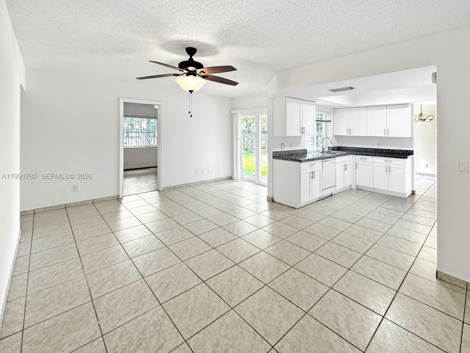 6802 Southwest 34th Court Miramar, FL 33023 - Photo 11 of 41 a kitchen with stainless steel appliances cabinets and a counter top space