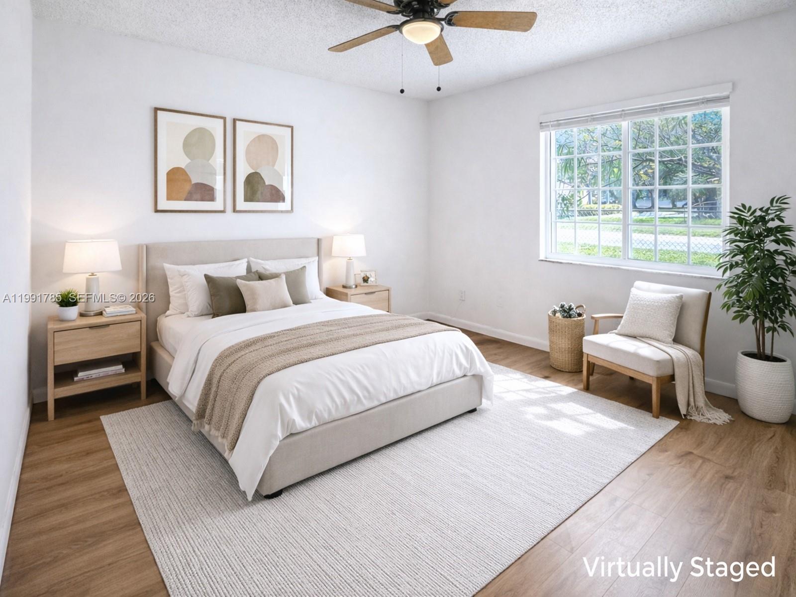 6802 Southwest 34th Court Miramar, FL 33023 - Photo 22 of 41 a bedroom with bed and a couch