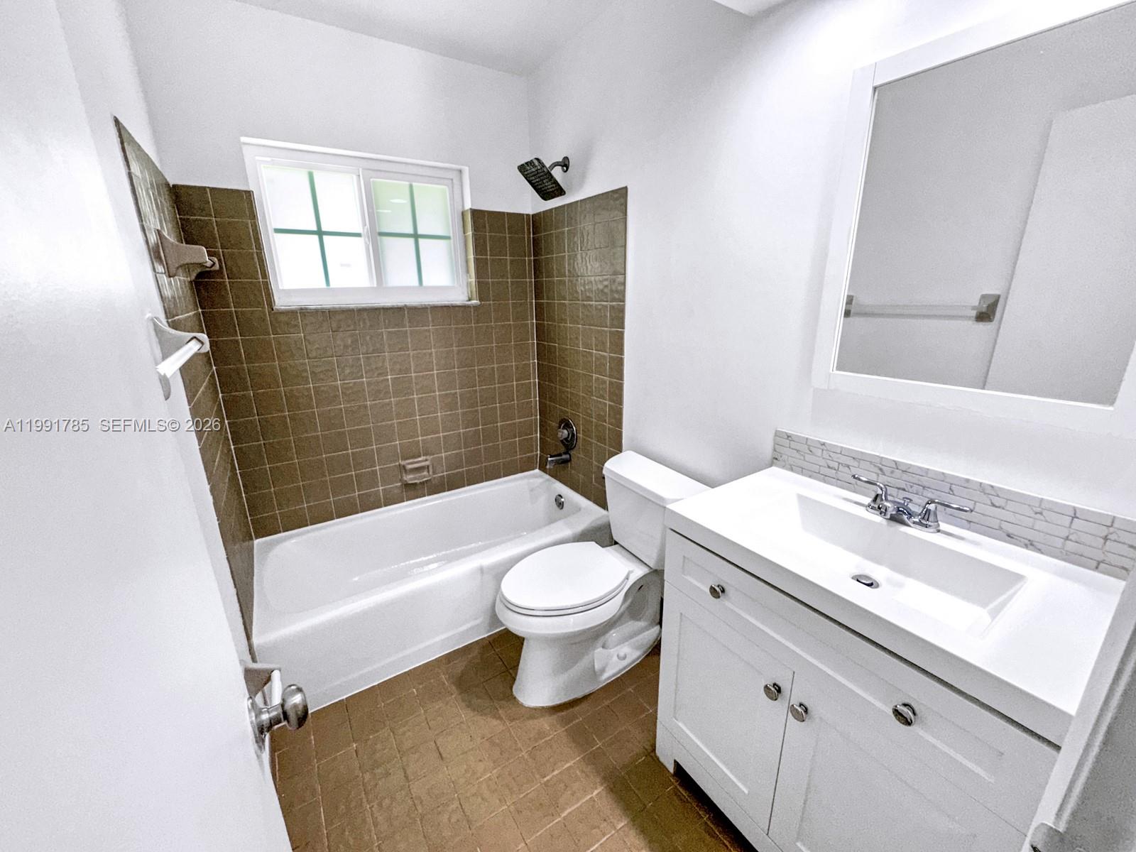 6802 Southwest 34th Court Miramar, FL 33023 - Photo 28 of 41 a bathroom with a sink a toilet and shower