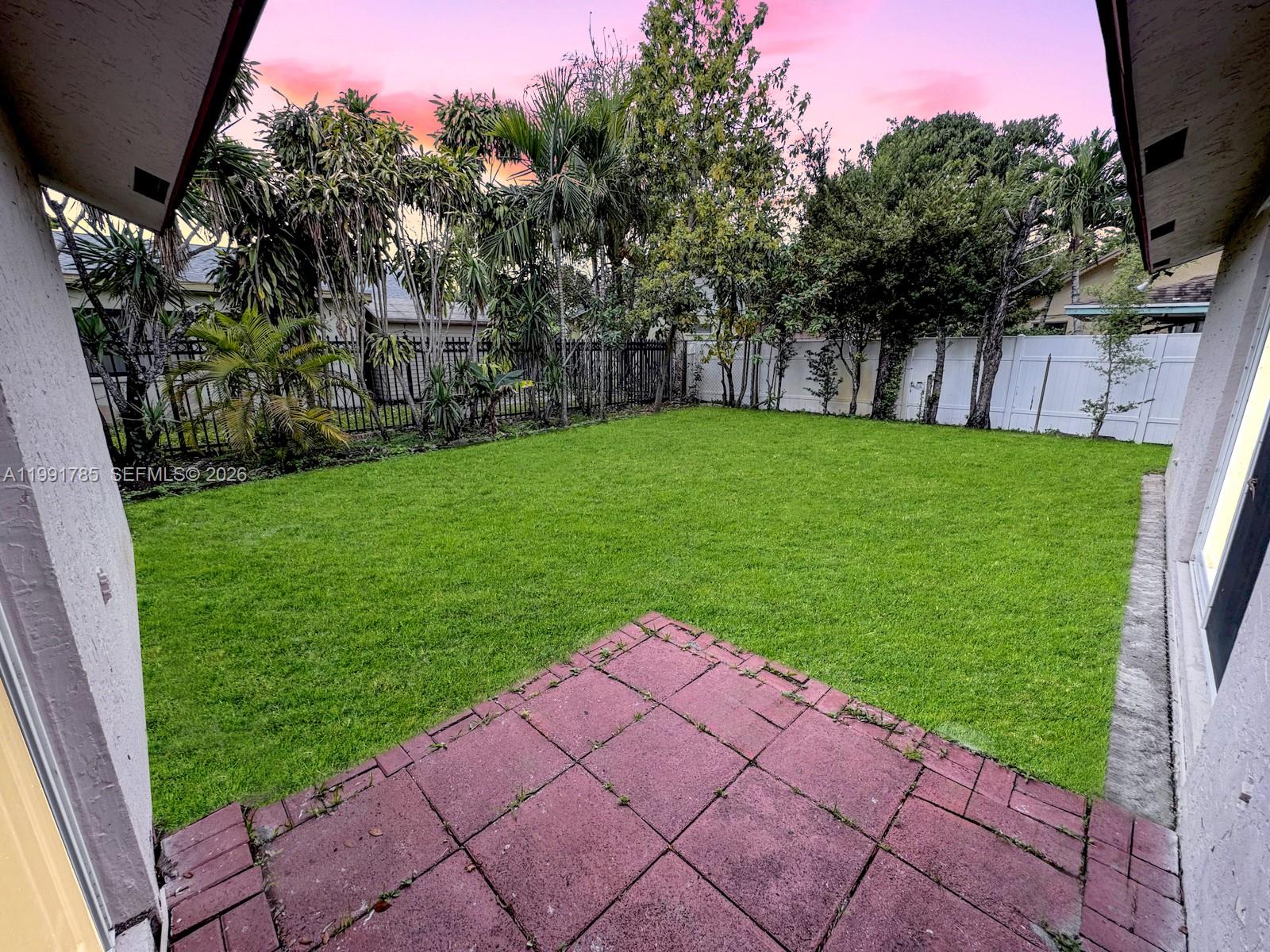 6802 Southwest 34th Court Miramar, FL 33023 - Photo 33 of 41 a view of a backyard with a garden