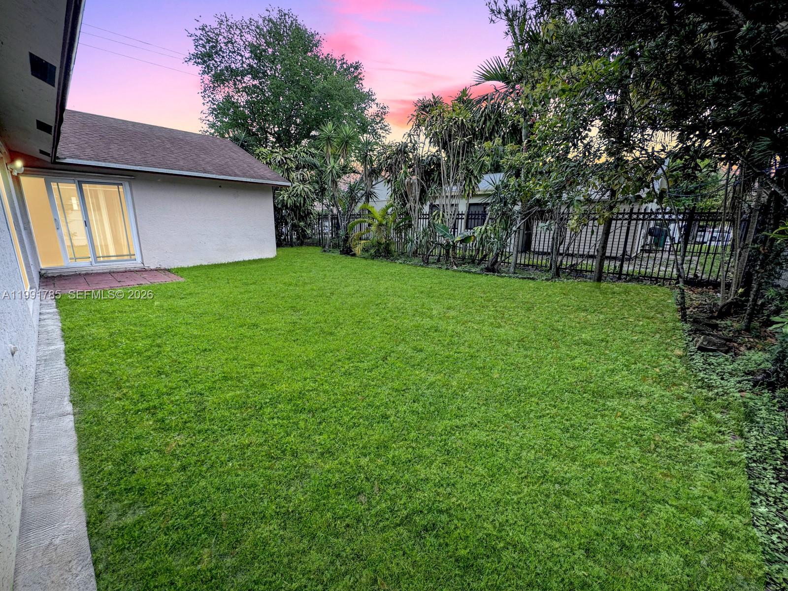 6802 Southwest 34th Court Miramar, FL 33023 - Photo 35 of 41 a view of a backyard with large trees