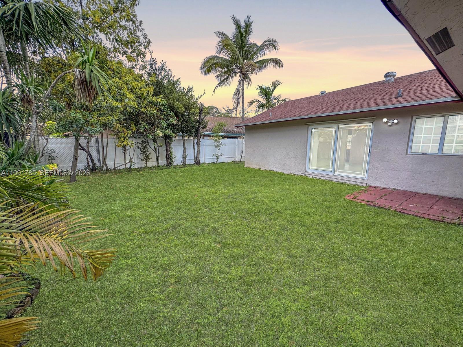 6802 Southwest 34th Court Miramar, FL 33023 - Photo 36 of 41 a house view with a garden space
