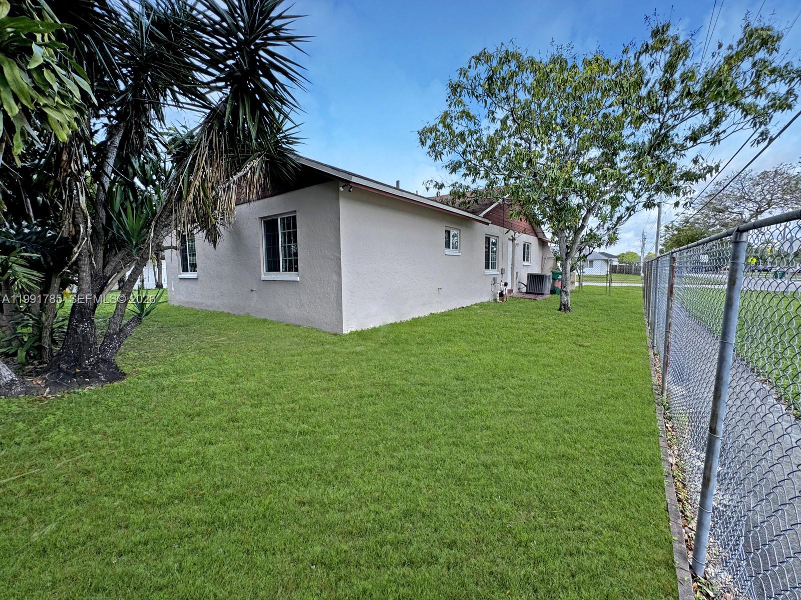 6802 Southwest 34th Court Miramar, FL 33023 - Photo 38 of 41 a front view of house with a garden