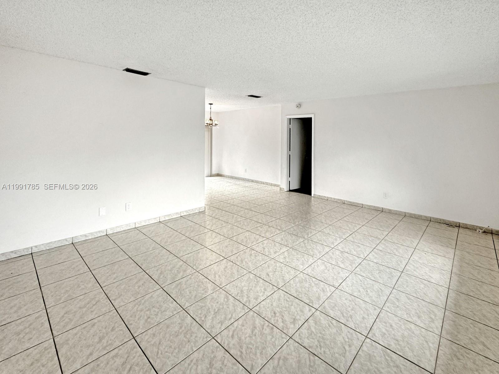 6802 Southwest 34th Court Miramar, FL 33023 - Photo 5 of 41 a view of a room with an empty space and a sink