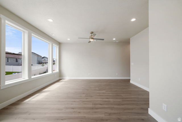 175 West 930 North Santaquin, UT 84655 - Photo 5 of 22 Spacious interior featuring wood-finish flooring, a contemporary ceiling fan, and recessed lighting