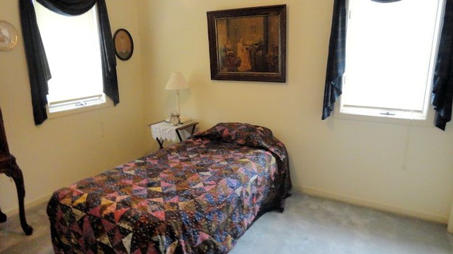 612 North 6th Street Rochelle, IL 61068 - Photo 11 of 14 a bedroom with a bed and a window