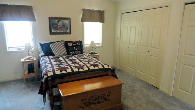 612 North 6th Street Rochelle, IL 61068 - Photo 8 of 14 a bedroom with a bed and a window