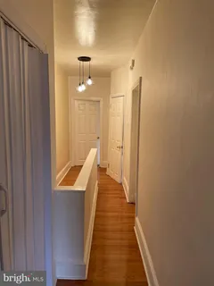 a view of a bathroom with a sink and mirror