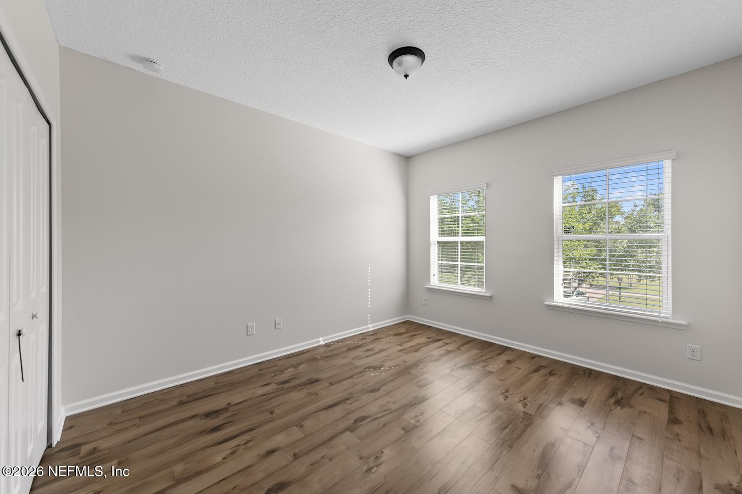 29 Myrtle Park Point Ponte Vedra, FL 32081 - Photo 36 of 59 a view of an empty room with wooden floor and a window