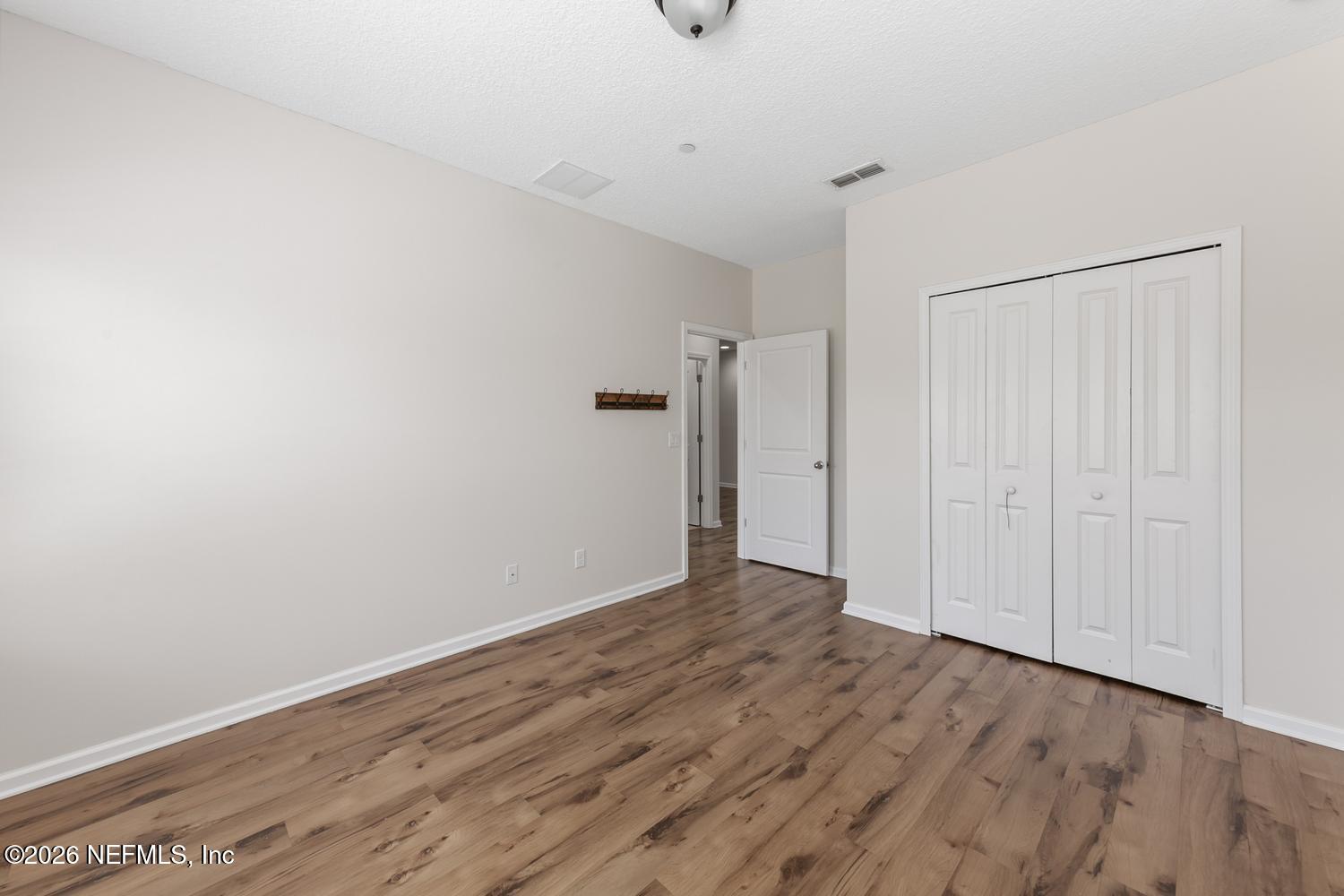 29 Myrtle Park Point Ponte Vedra, FL 32081 - Photo 37 of 59 a view of an empty room with wooden floor