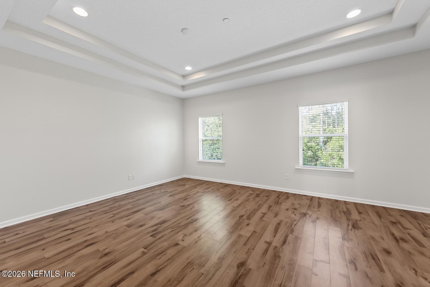 29 Myrtle Park Point Ponte Vedra, FL 32081 - Photo 5 of 59 an empty room with wooden floor and windows