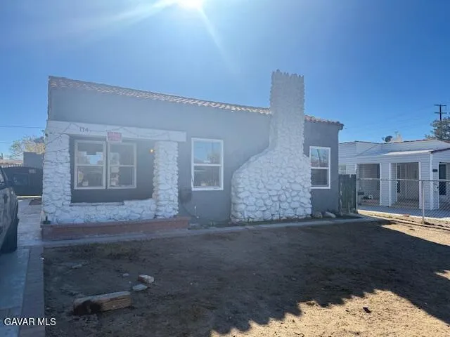 a view of house with yard