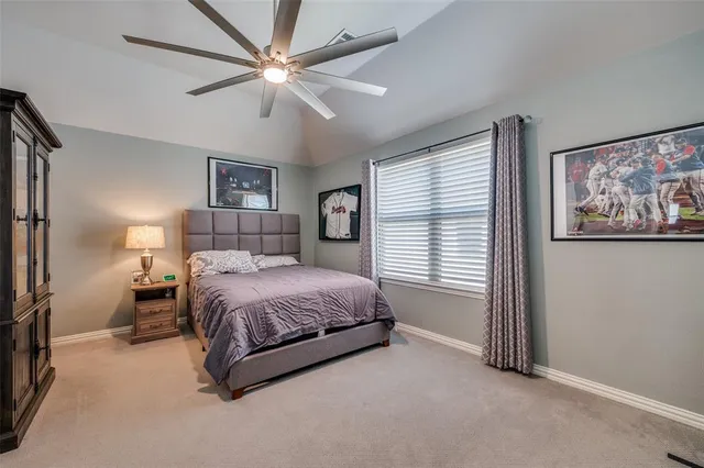 a spacious bedroom with a bed and a window