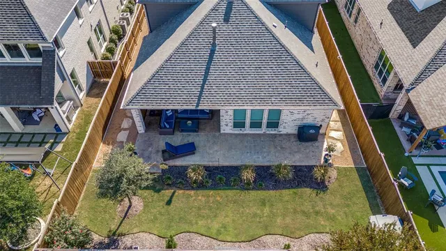 an aerial view of a house with swimming pool