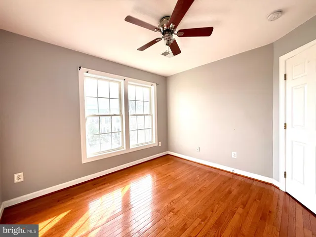 a spacious bathroom with a tub sink and mirror