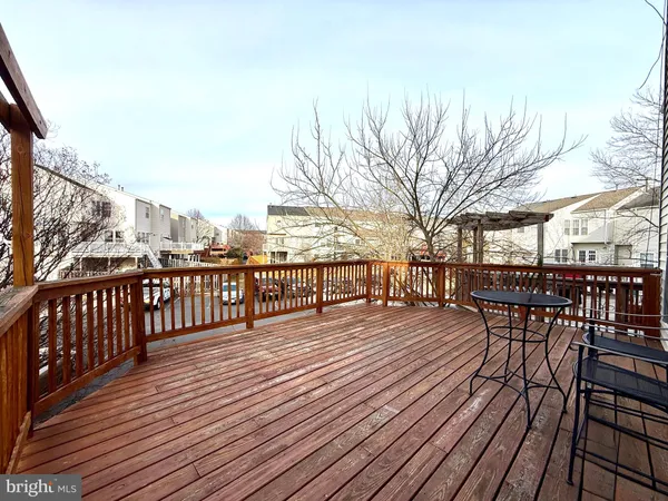 a bathroom with a granite countertop sink a toilet a mirror and bathtub