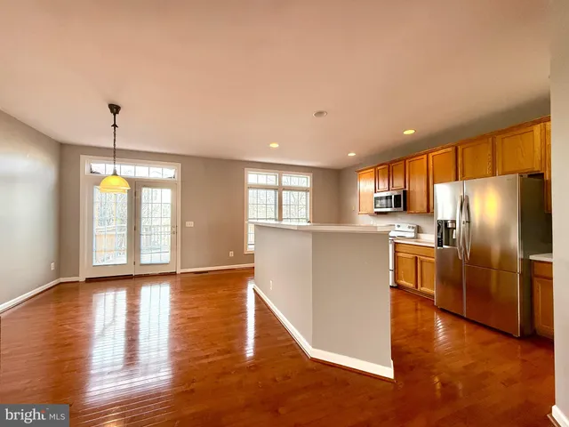 a view of a kitchen with a dishwasher cabinets and a floor to ceiling window