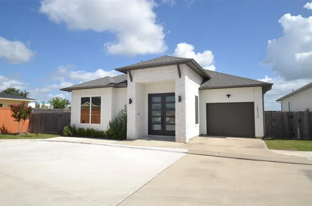 a front view of a house with a outdoor space