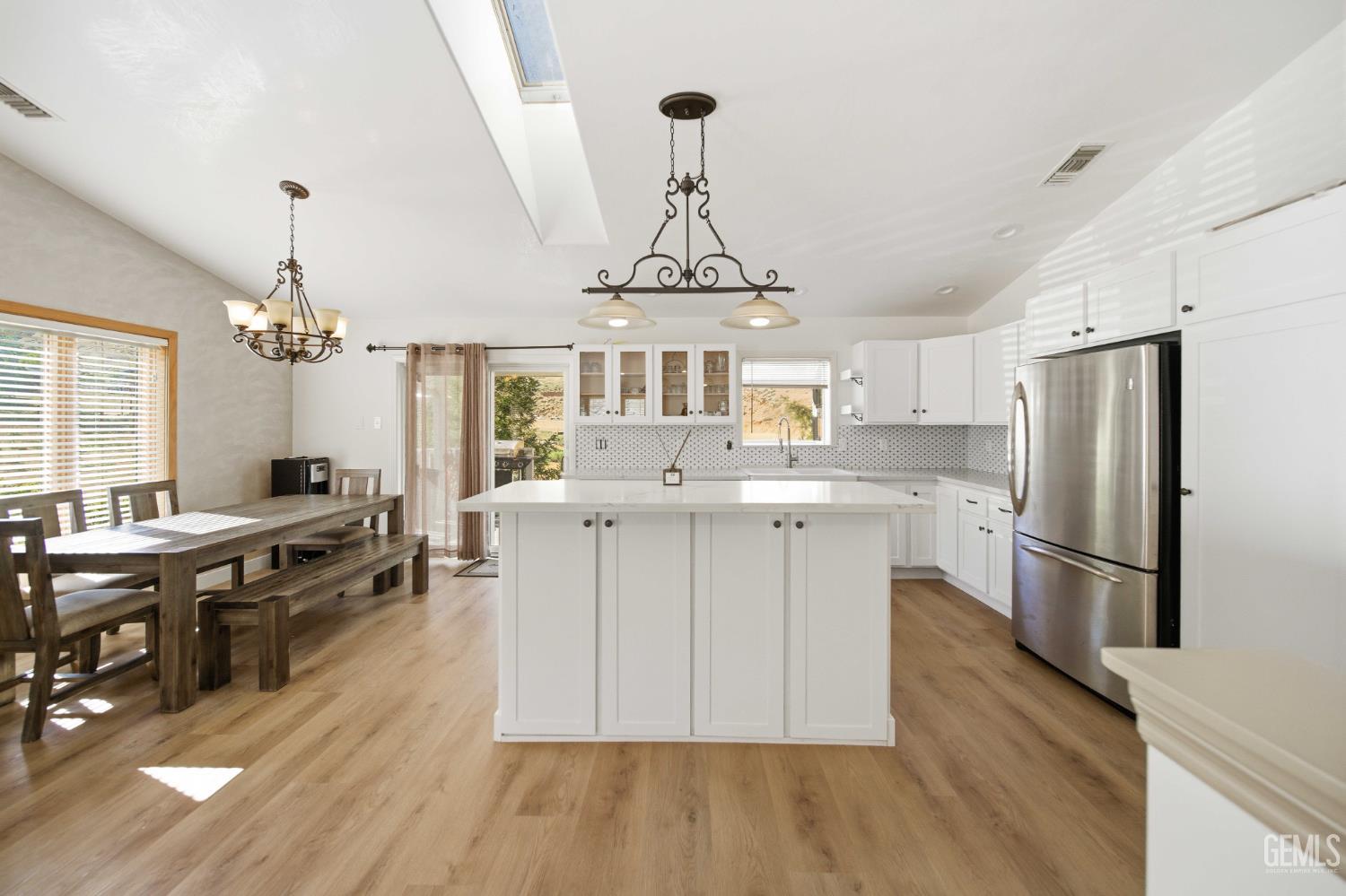 Undisclosed Address Lebec, CA 93243 - Photo 13 of 29 a kitchen with a center island wooden floor and stainless steel appliances