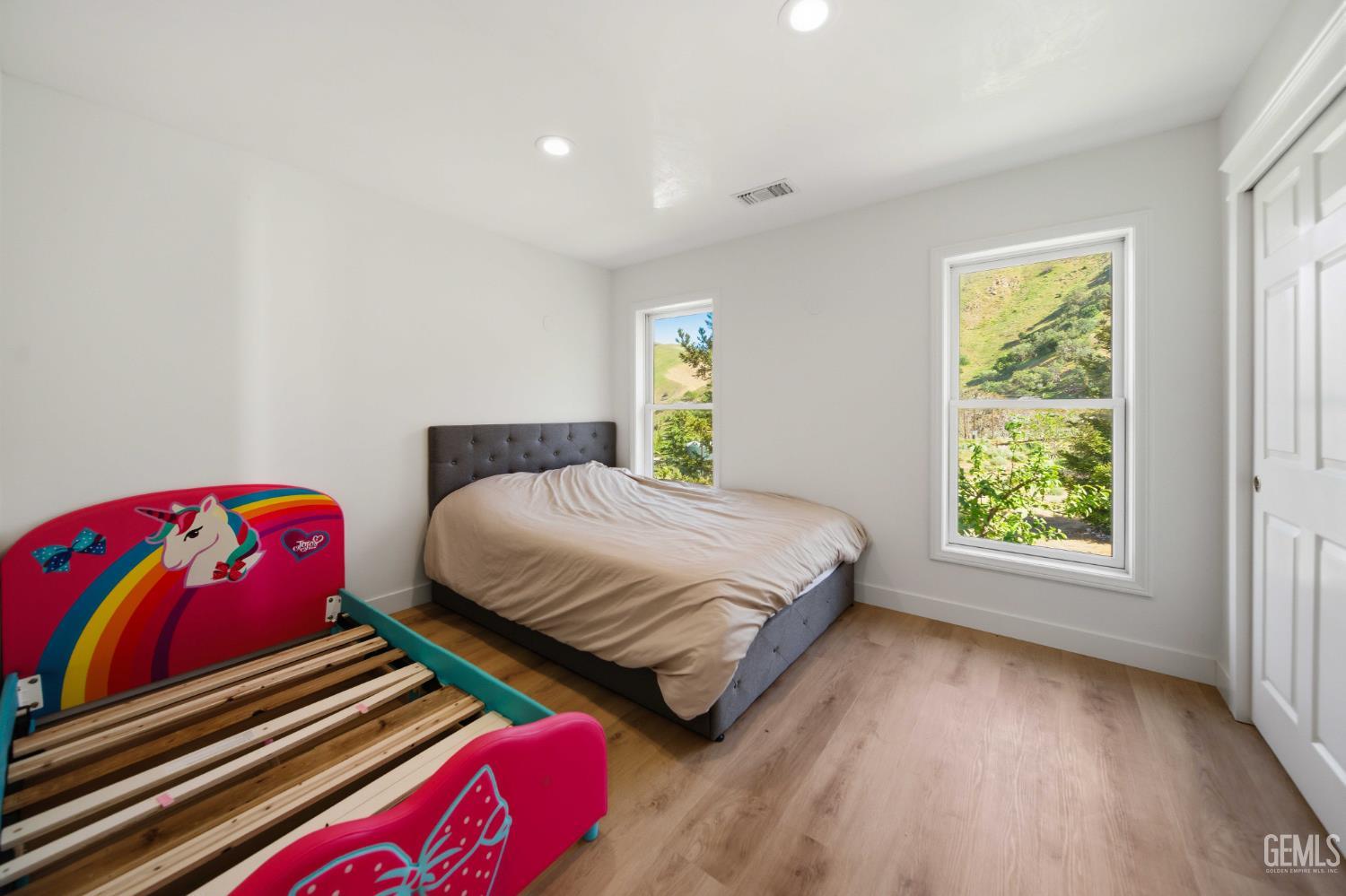 Undisclosed Address Lebec, CA 93243 - Photo 17 of 29 a bedroom with a bed and a window