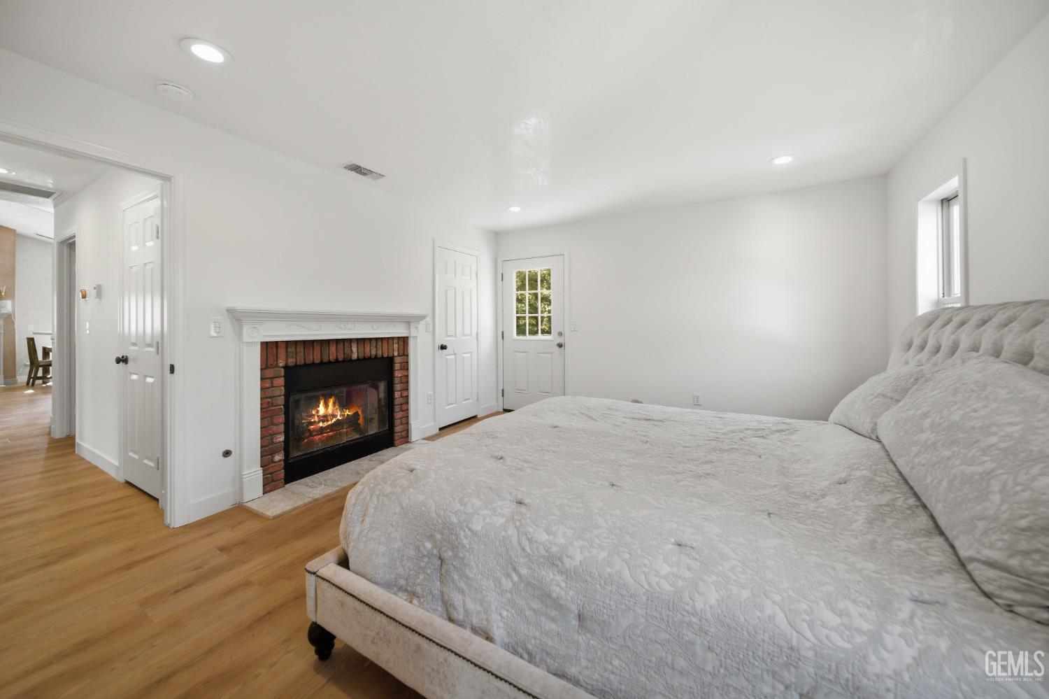Undisclosed Address Lebec, CA 93243 - Photo 19 of 29 a spacious bedroom with a bed and a fireplace