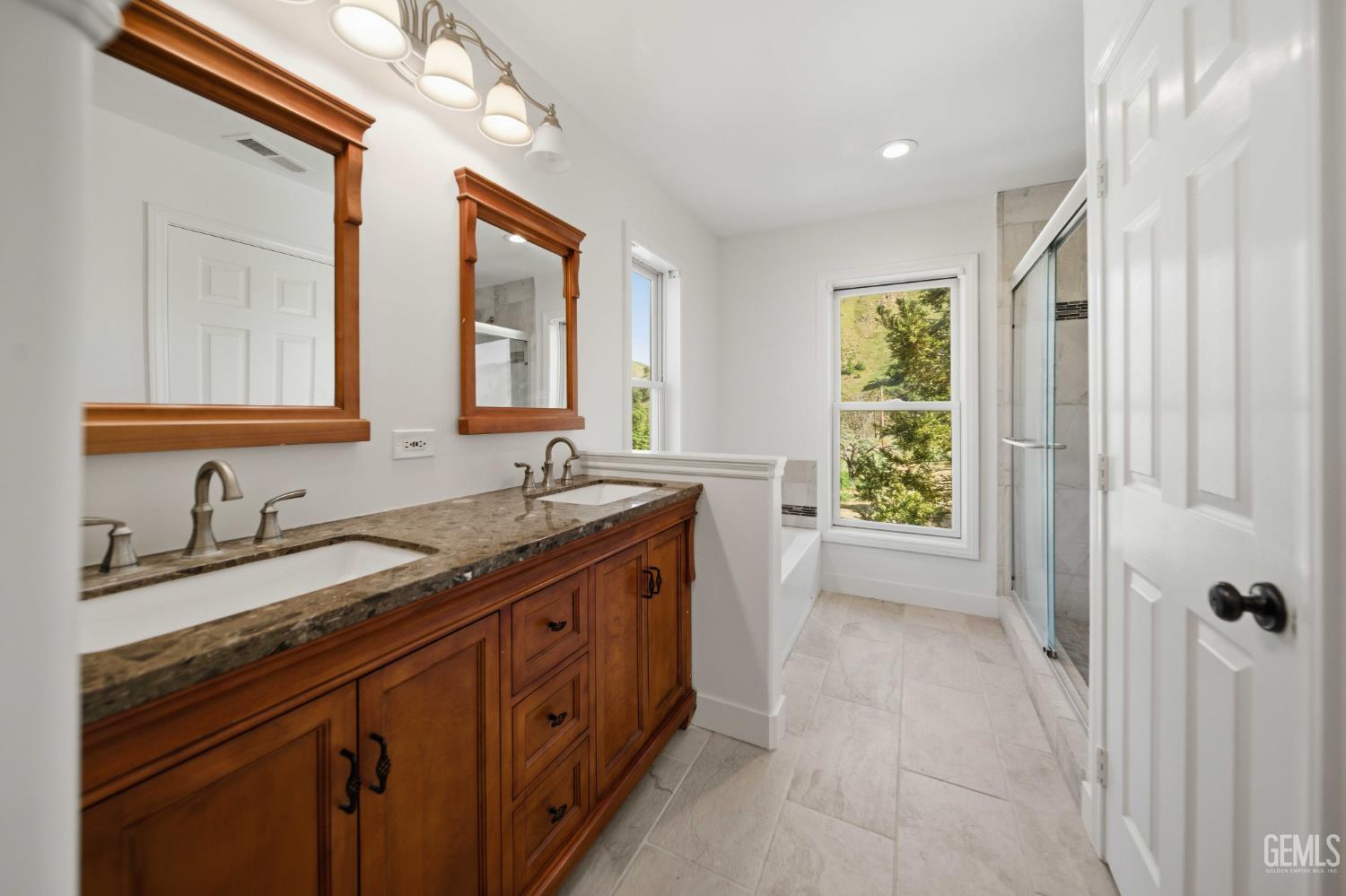 Undisclosed Address Lebec, CA 93243 - Photo 20 of 29 a spacious bathroom with a granite countertop sink mirror and a bathtub