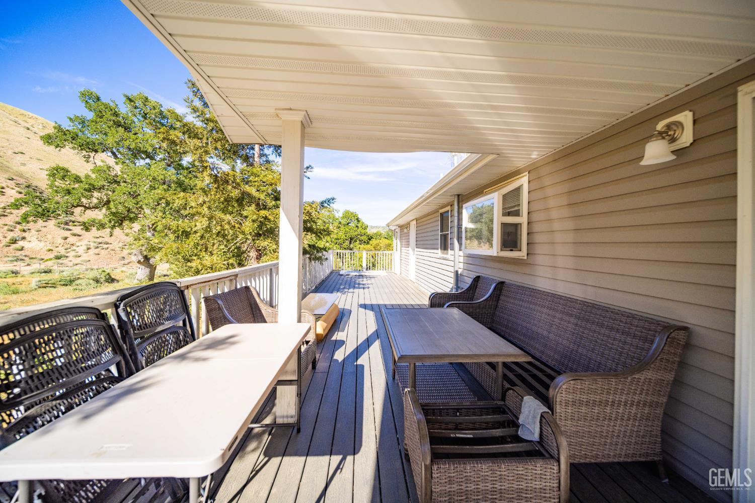 Undisclosed Address Lebec, CA 93243 - Photo 27 of 29 a view of balcony with wooden floor and outdoor seating