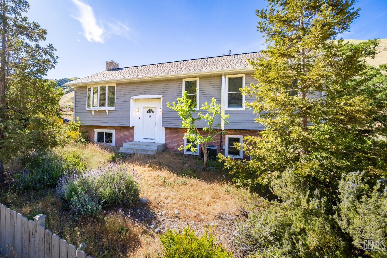 Undisclosed Address Lebec, CA 93243 - Photo 4 of 29 a front view of a house with a yard