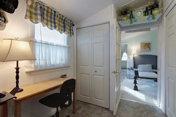 a view of kitchen with furniture and lamp