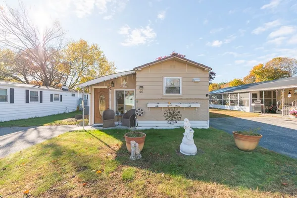 a front view of house with yard and porch