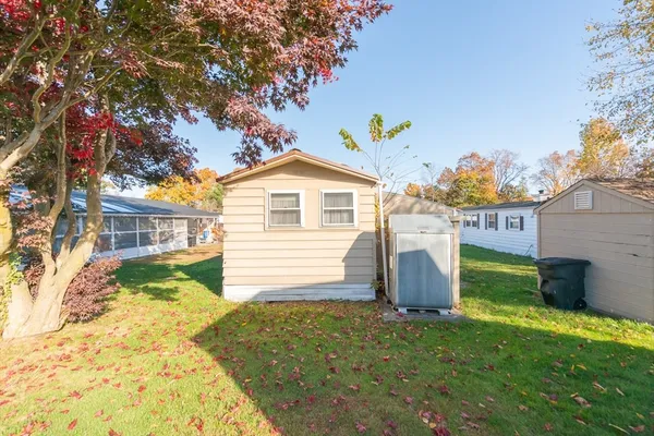 a view of a house with a backyard