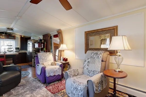 a living room with furniture and a lamp