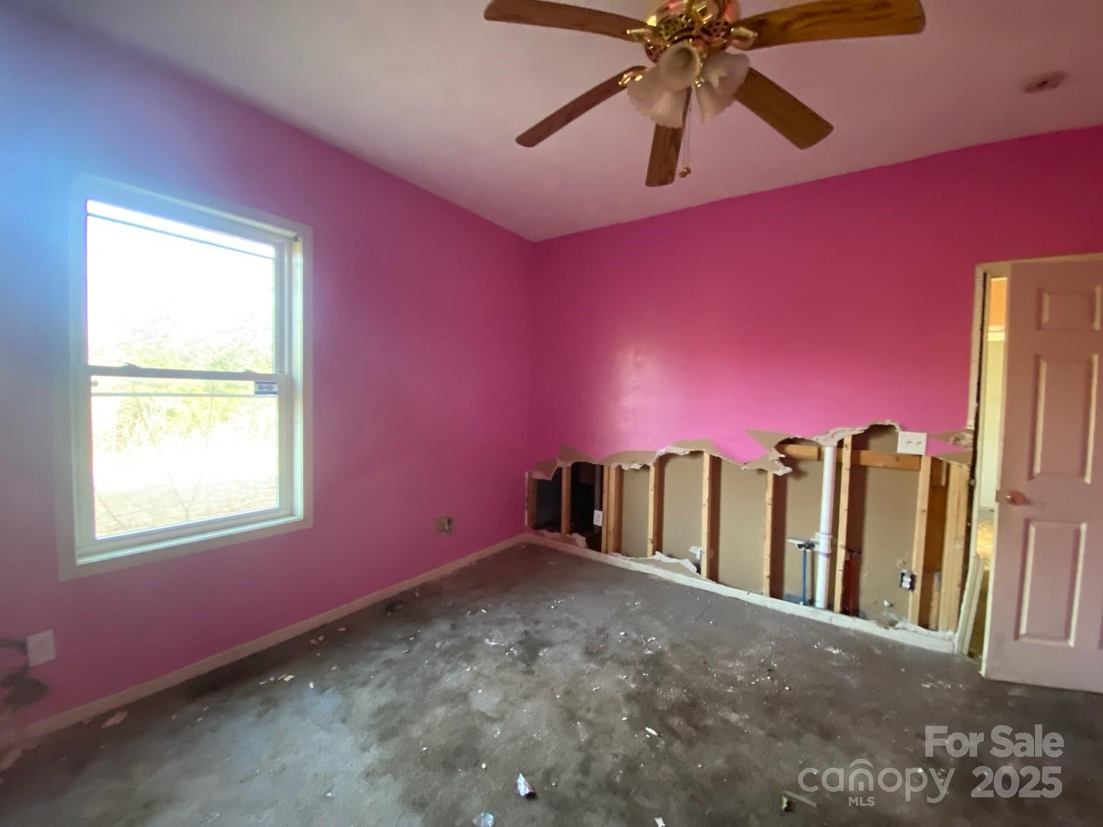 120 Seaboard Street Rockingham, NC 28379 - Photo 21 of 21 a view of a livingroom with a ceiling fan and window