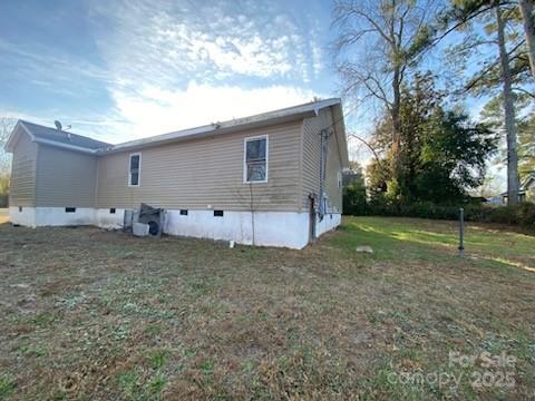 120 Seaboard Street Rockingham, NC 28379 - Photo 4 of 21 a view of a house with backyard and trees