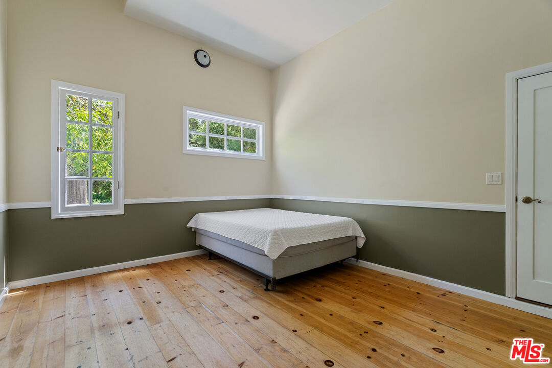 20912 Fontaine Road Topanga, CA 90290 - Photo 31 of 52 a bedroom with a bed and a window