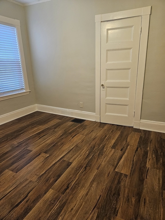 21 Baldwin Street, Unit 1 Malden, MA 02148 - Photo 16 of 19 a view of empty room with wooden floor and fan