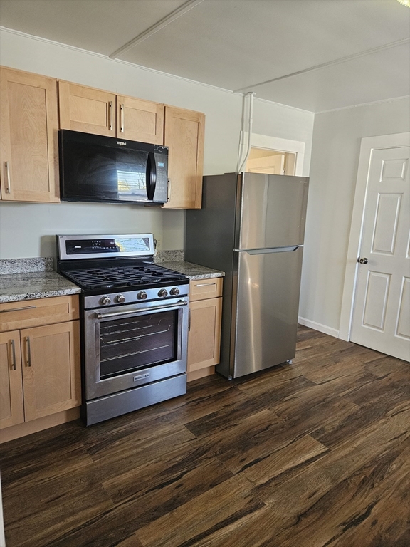 21 Baldwin Street, Unit 1 Malden, MA 02148 - Photo 4 of 19 a kitchen with a stove microwave and refrigerator