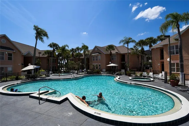 a view of swimming pool having outdoor seating