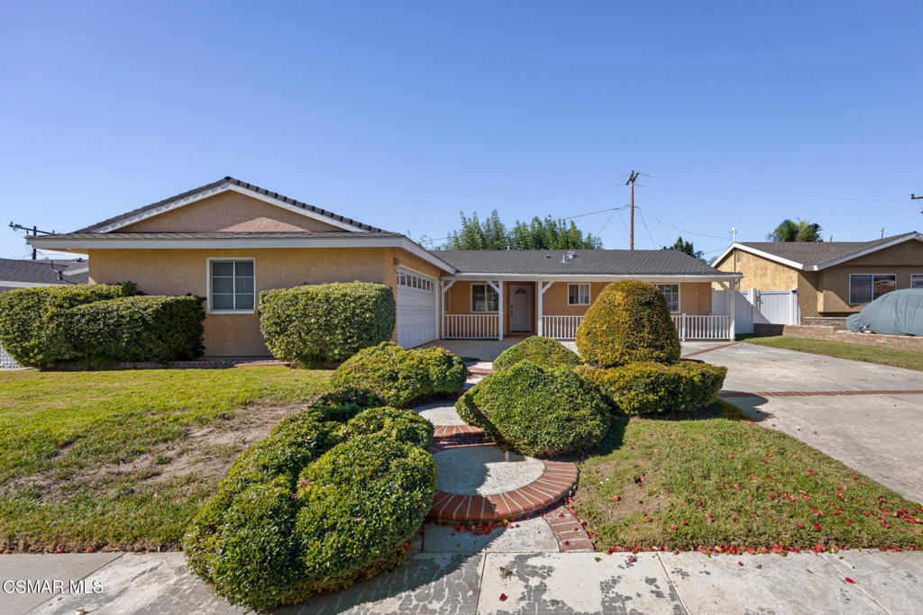1521 Church Street Simi Valley, CA 93065 - Photo 1 of 16 a front view of a house with a yard