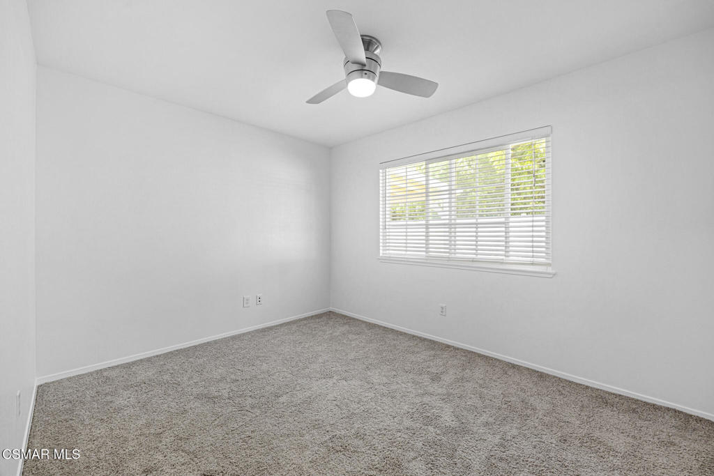 1521 Church Street Simi Valley, CA 93065 - Photo 11 of 16 an empty room with a window and a ceiling fan