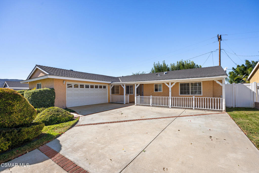 1521 Church Street Simi Valley, CA 93065 - Photo 2 of 16 a front view of a house with a yard and garage