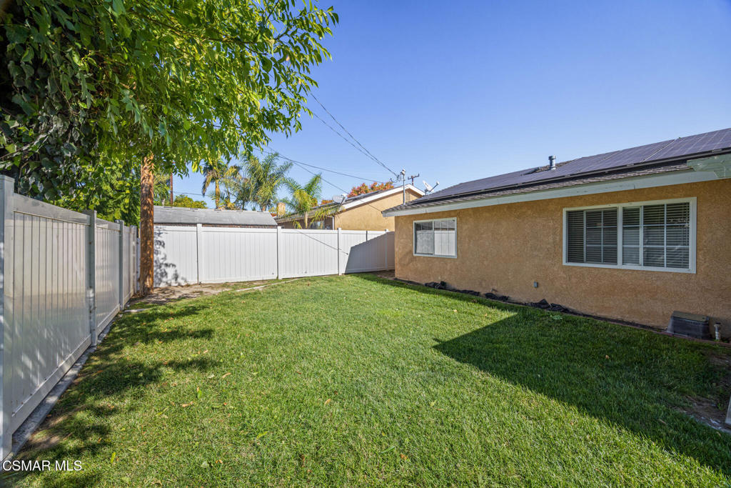 1521 Church Street Simi Valley, CA 93065 - Photo 6 of 16 a view of a backyard with plants and a large tree
