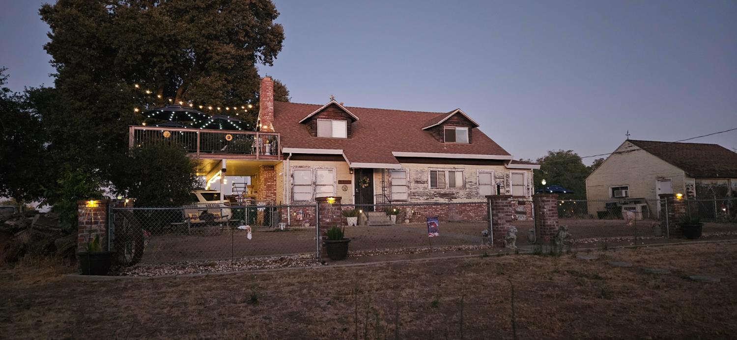 20822 Disch Road Lockeford, CA 95237 - Photo 2 of 30 a front view of a house with a yard