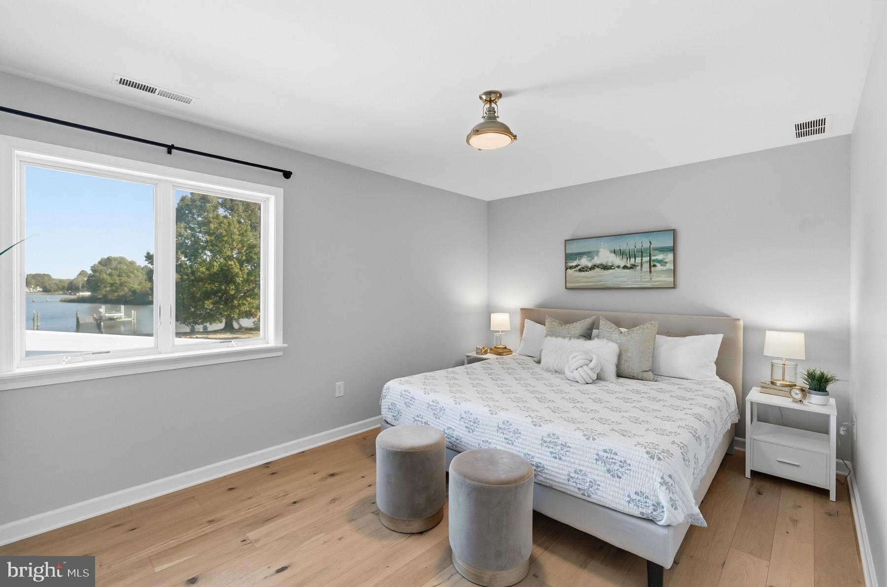 25500 Chance Farm Road St. Michaels, MD 21663 - Photo 25 of 43 a bedroom with a large bed and a window