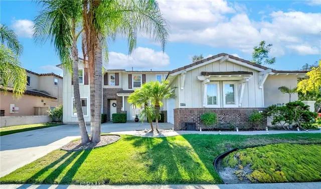 a front view of a house with garden