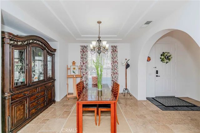 a dining room with furniture and window