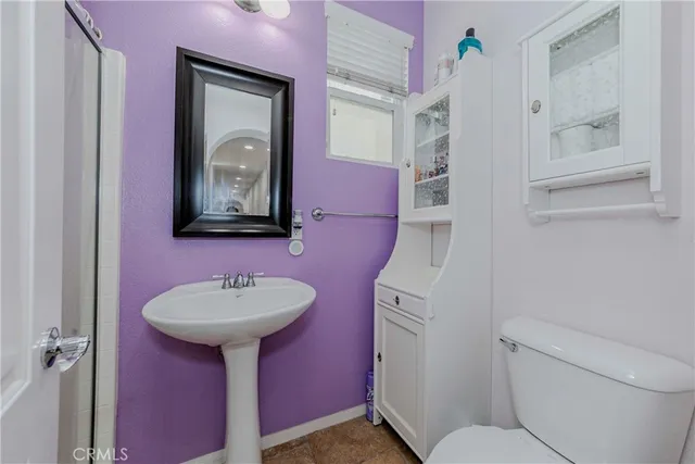a view of a storage & utility room with closet fan