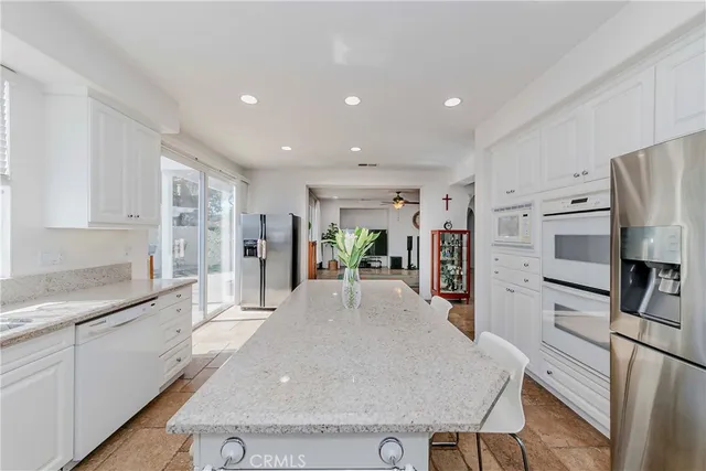 a view of living room with furniture and a flat screen tv