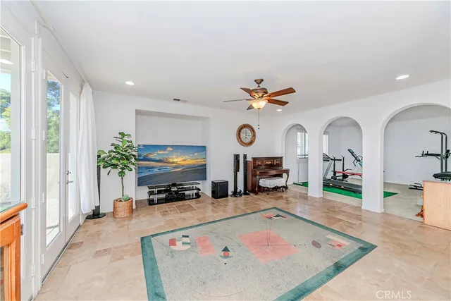 a living room with lots of gym equipment